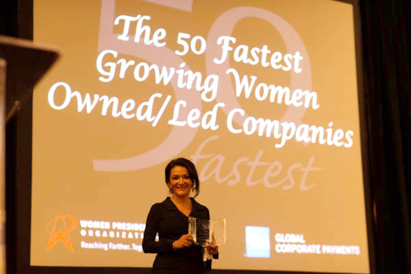 Nina Vaca accepts award for Pinnacle Group, which has been named the fastest growing women-owned/led firm in the U.S. by the Women Presidents' Organization.